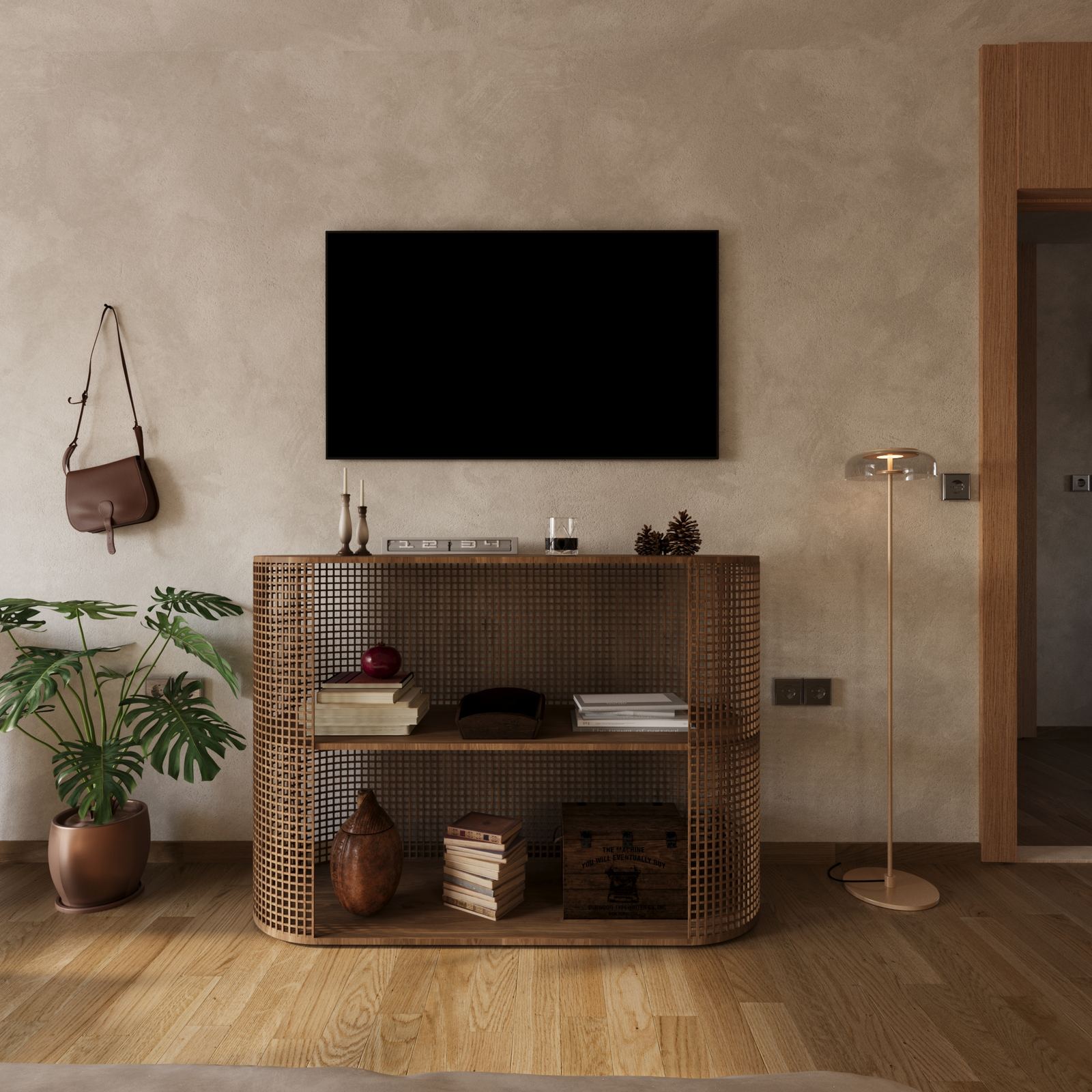 Textured wall with a wall-mounted TV above a woven console, styled with books, ceramics, and a floor lamp.
