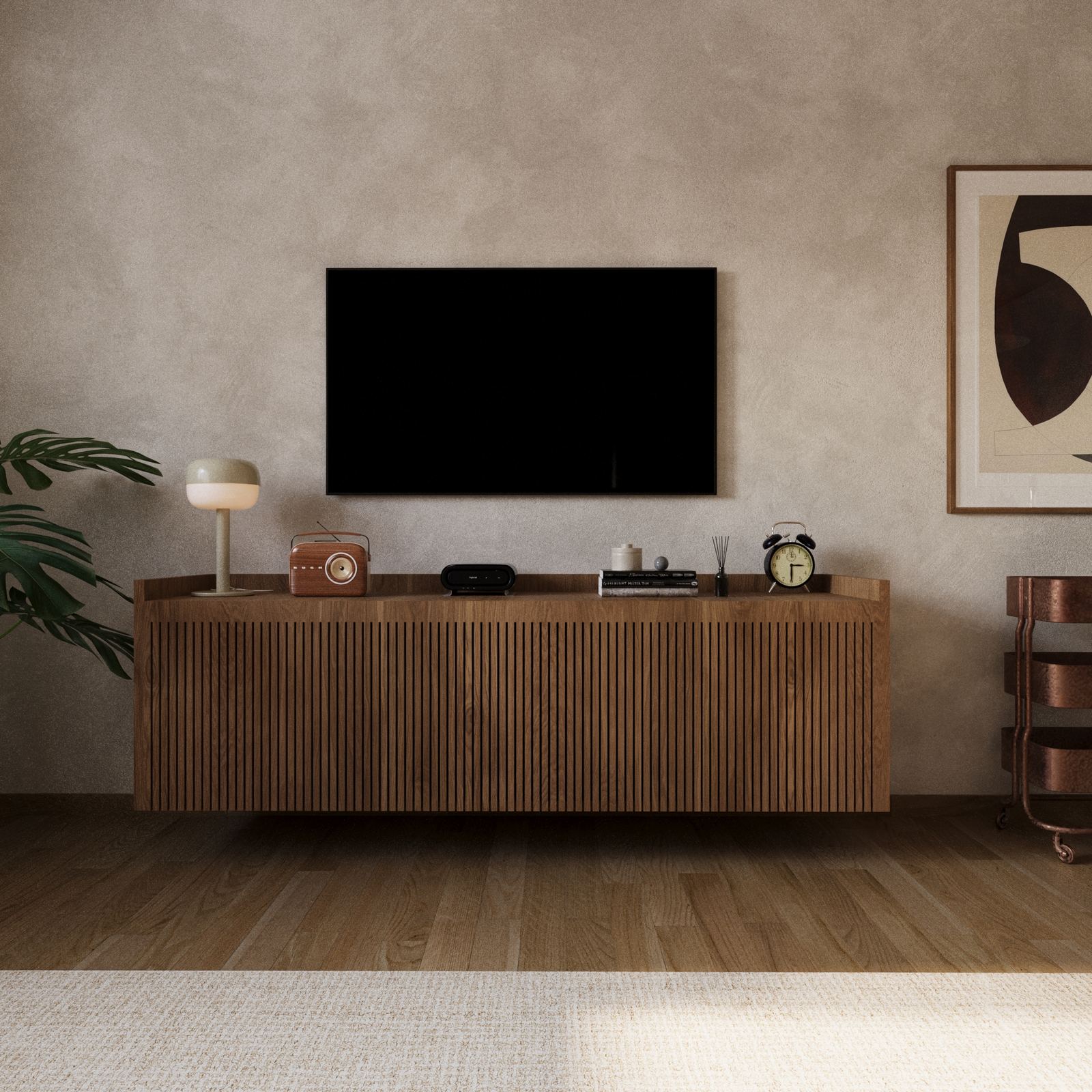 Living room wall with a wooden console, wall-mounted TV, and small decorative objects.