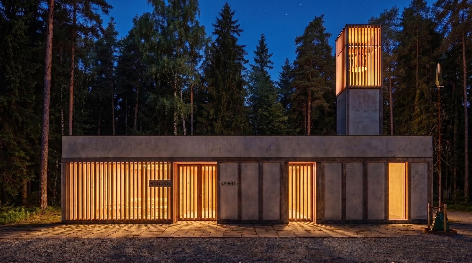Night view of the minimalist chapel, illuminated from within to cast a warm golden light through the vertical timber slats and the slatted bell tower, set against a dark pine forest.