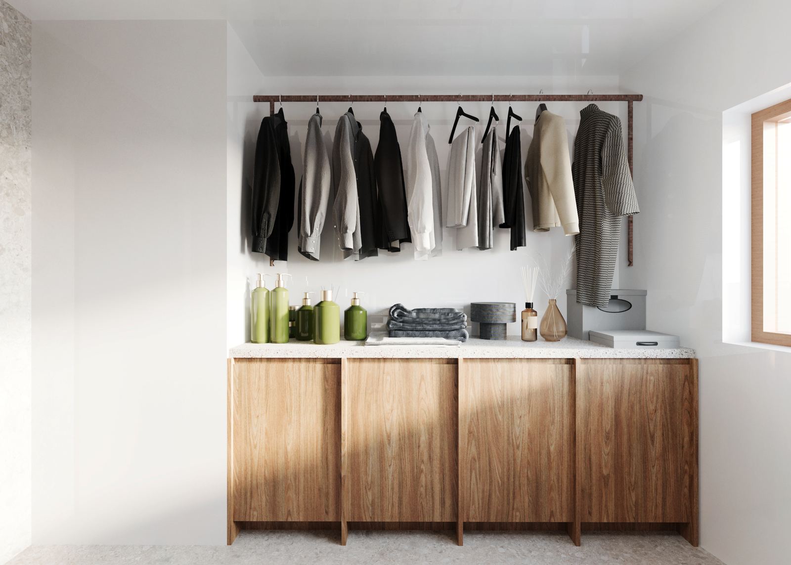 Utility storage space with hanging rail, wooden cabinetry, and integrated work surface for everyday use.
