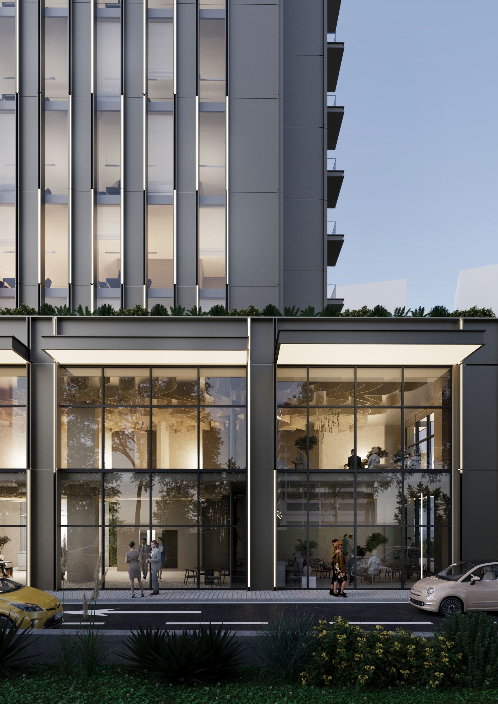 Ground floor façade of TED Hotel & Offices with transparent glazing and interior activity