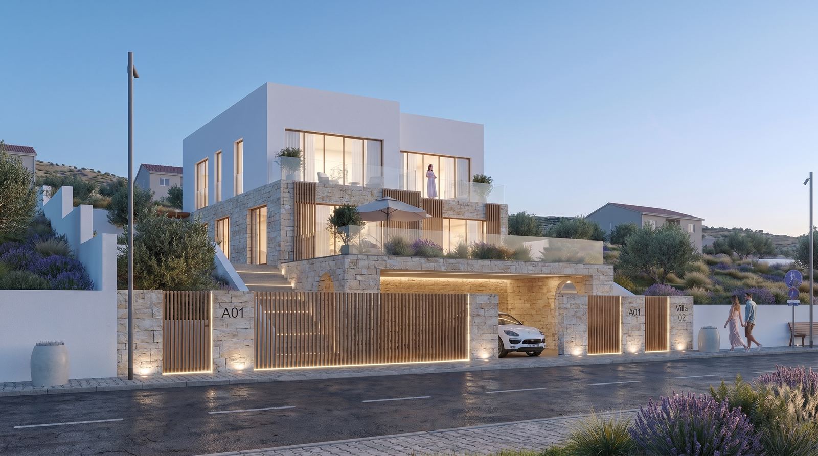 Semi-detached Mediterranean villa in Sarandë with layered stone volumes, terraces, and warm evening lighting overlooking the Ionian Sea